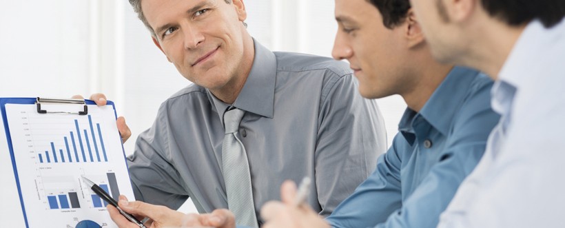 Businessmen Discussing Graph